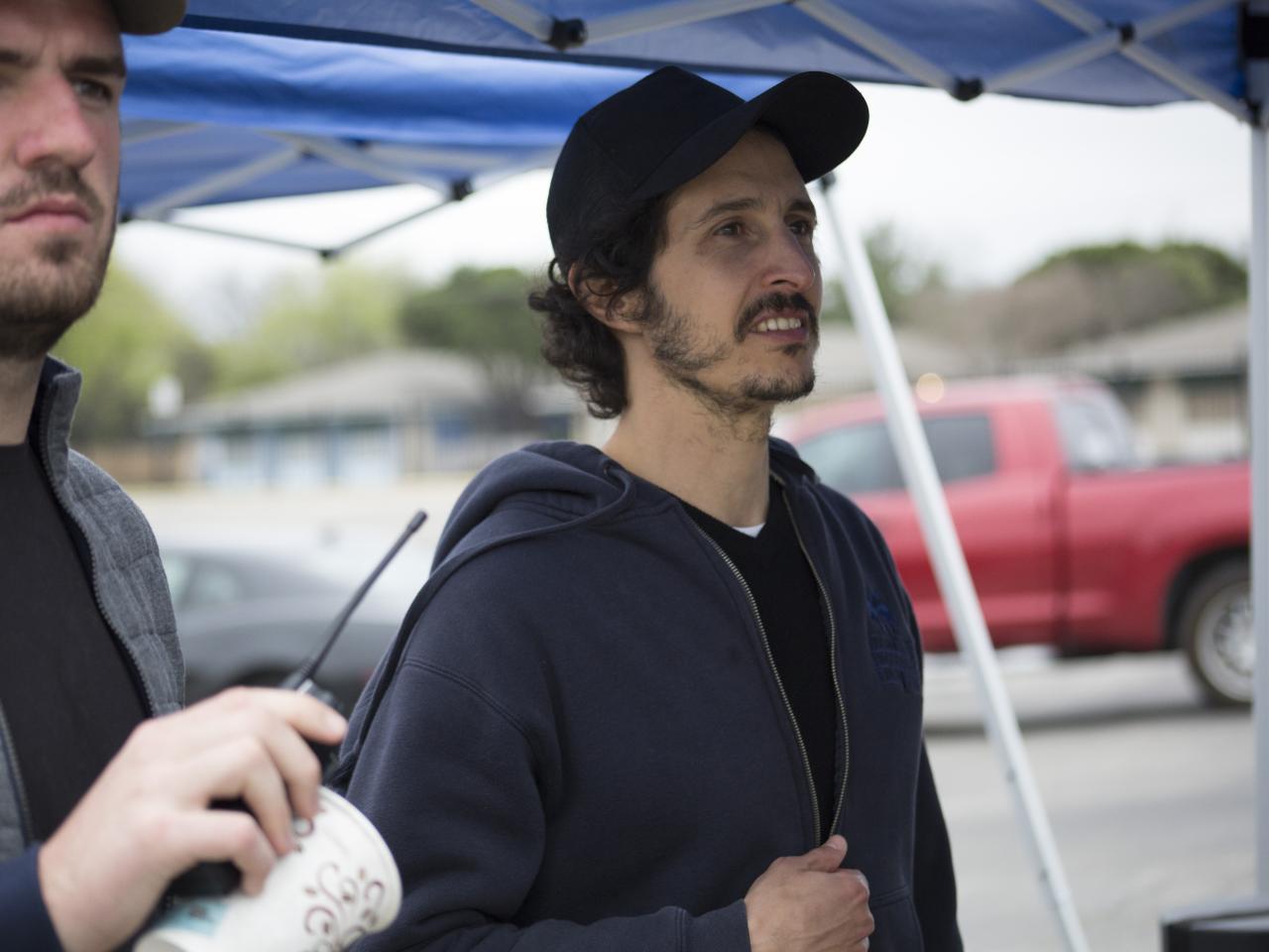 Joel Fendelman and another filmmaker working on set, watching something out of view.